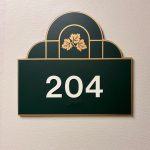 Apartment 204 sign on an interior wall at Emerald Pointe Senior Living in Greenville, Illinois.