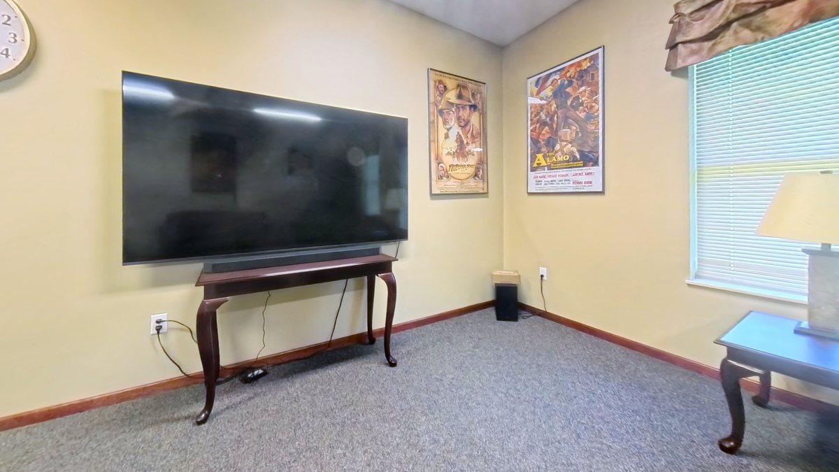 Emerald Pointe living room with large-screen television